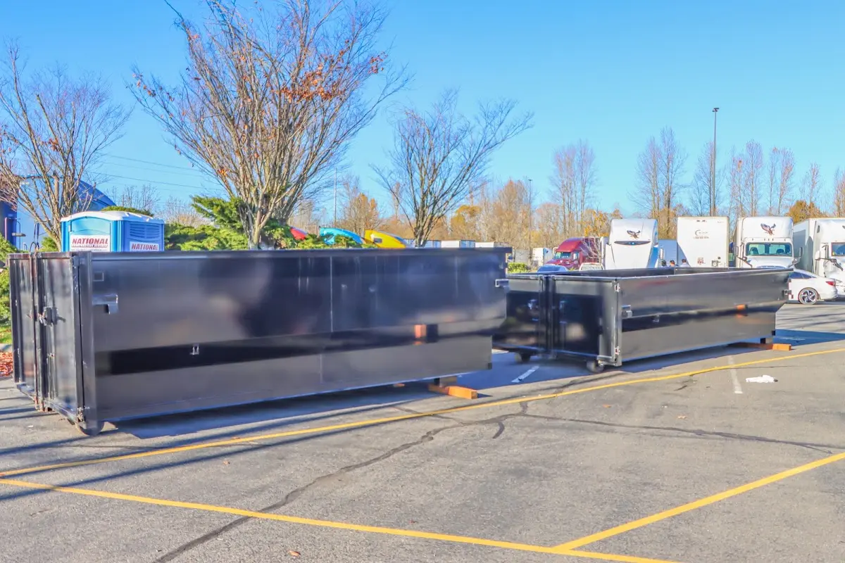 Professional dumpster rental service with roll-off container on residential driveway in Wylie